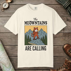 Ivory color unisex graphic t-shirt with "The Meowntains Are Calling" design