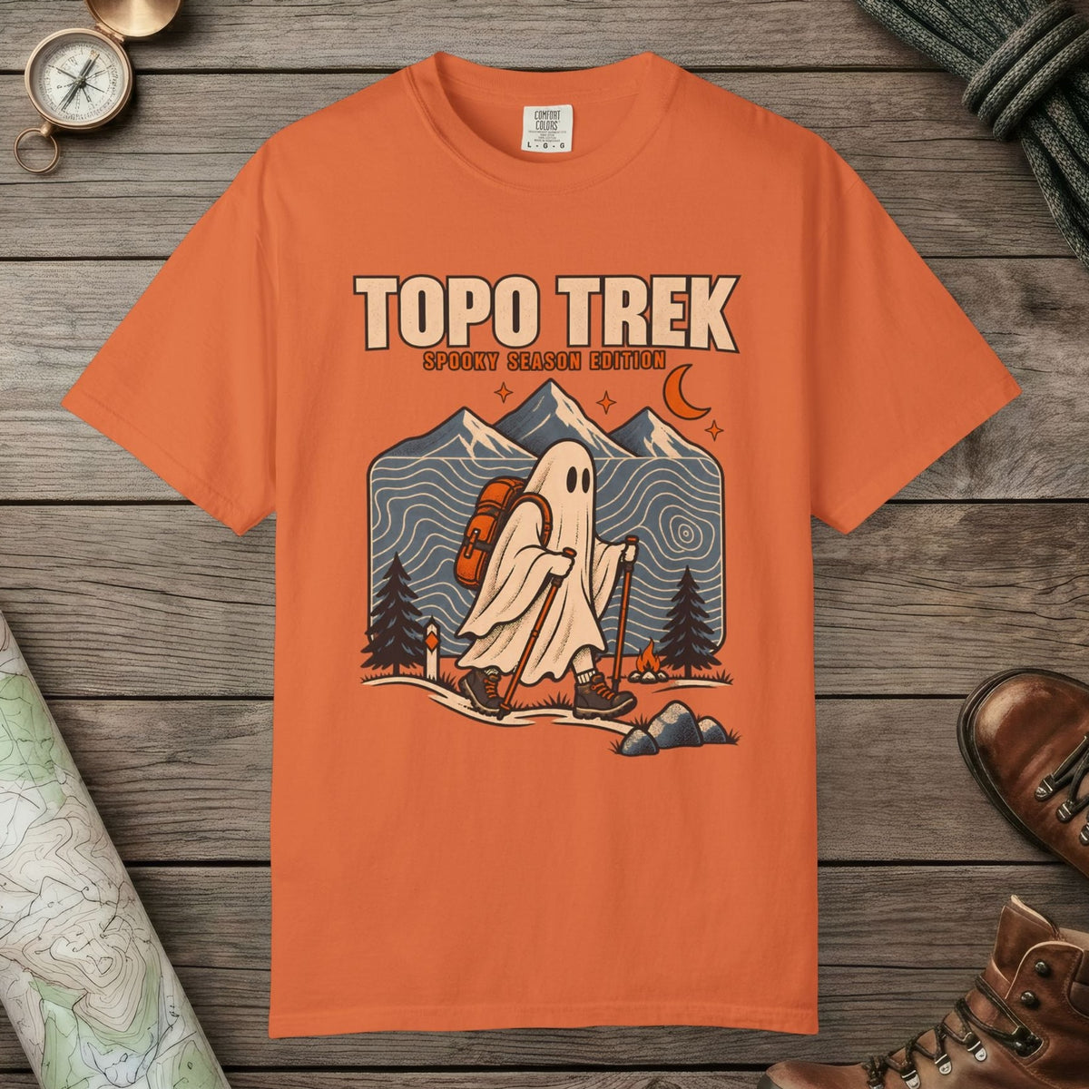 Burnt Orange color unisex graphic t-shirt with "Topo Ghost Trek" design