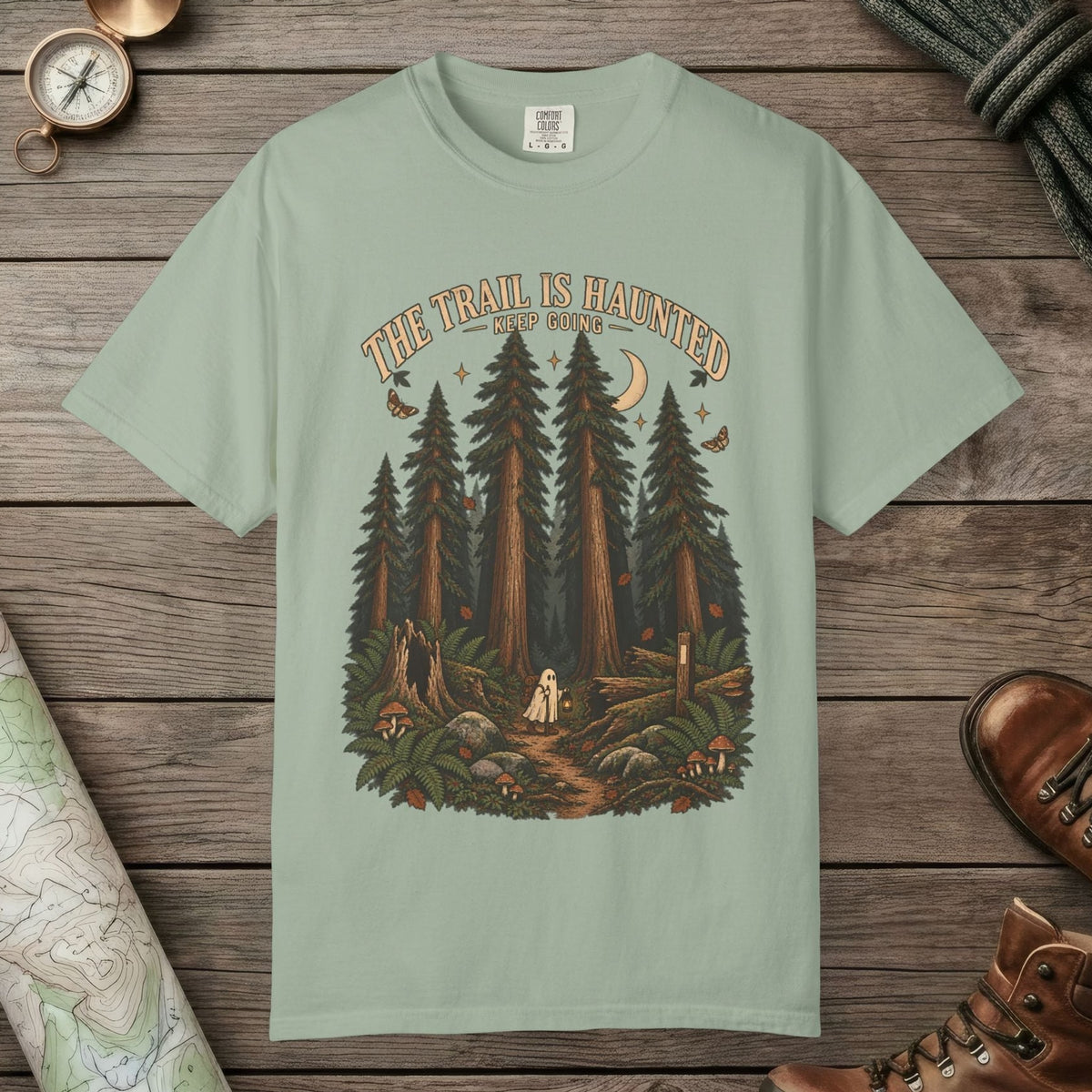 Bay color unisex graphic t-shirt with "Trail Is Haunted" design