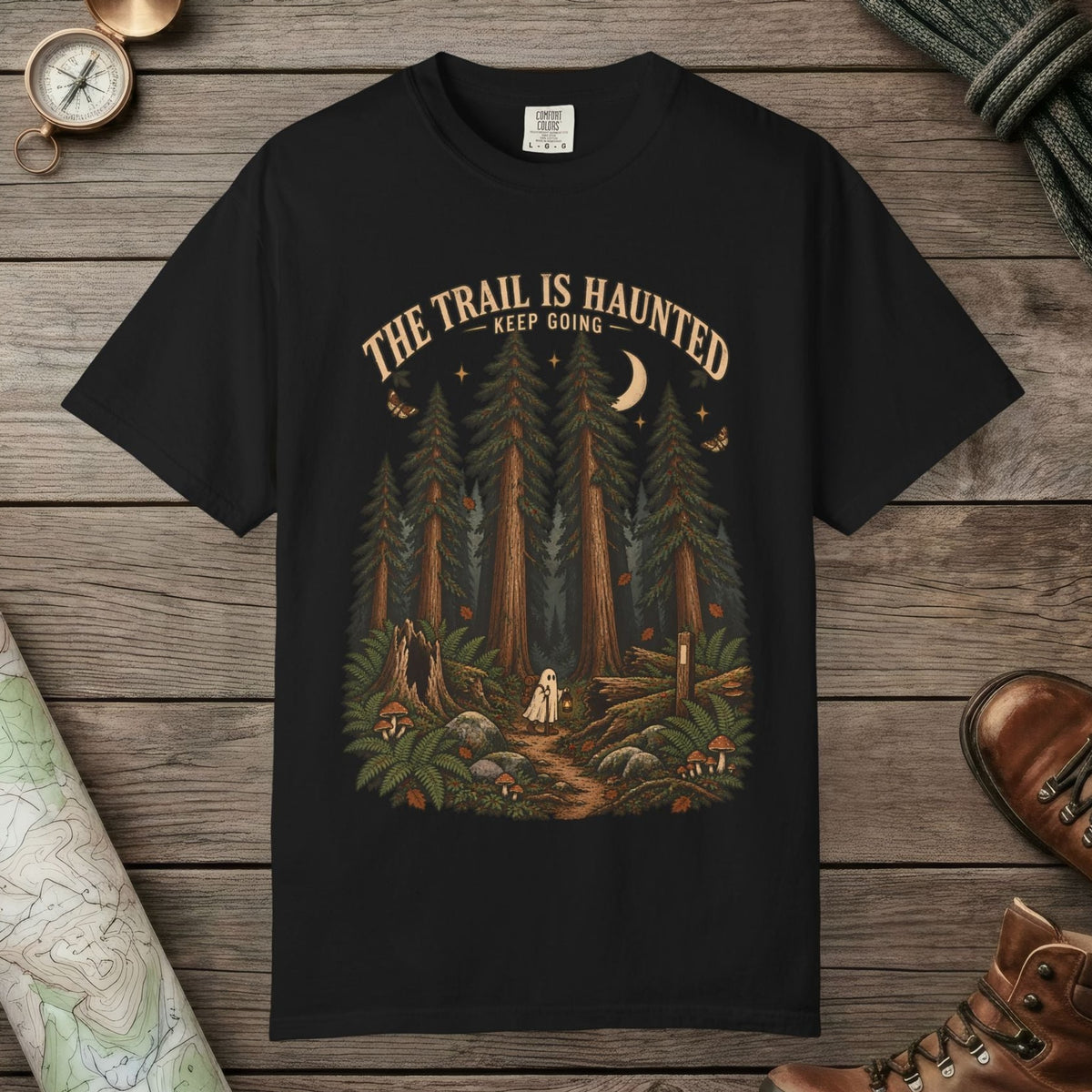 Black color unisex graphic t-shirt with "Trail Is Haunted" design