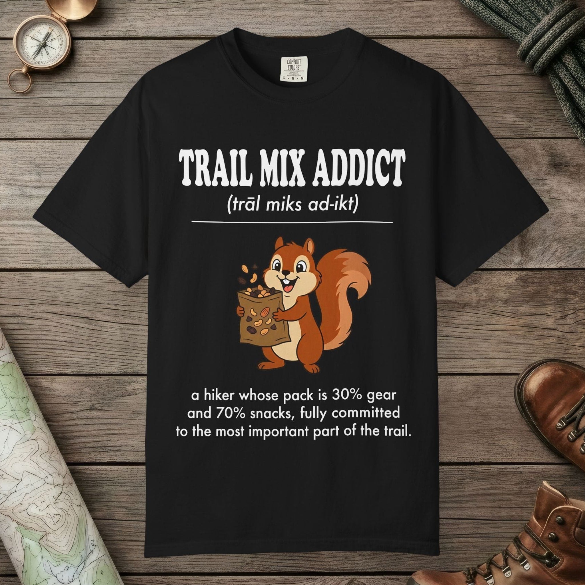 Black color unisex graphic t-shirt with "Trail Mix Addict Definition" design