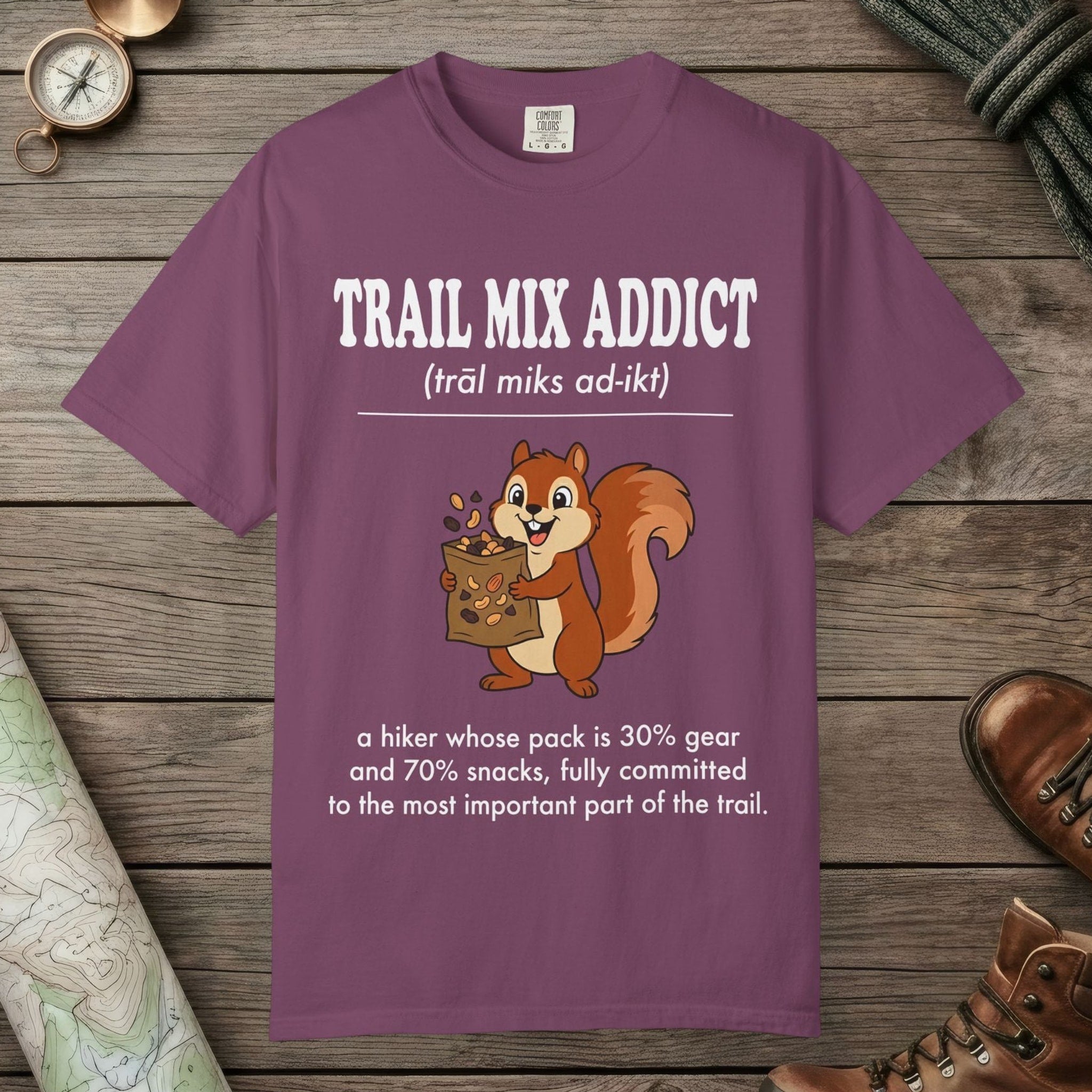 Berry color unisex graphic t-shirt with "Trail Mix Addict Definition" design