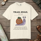 Ivory color unisex graphic t-shirt with "Trail Snail Definition" design