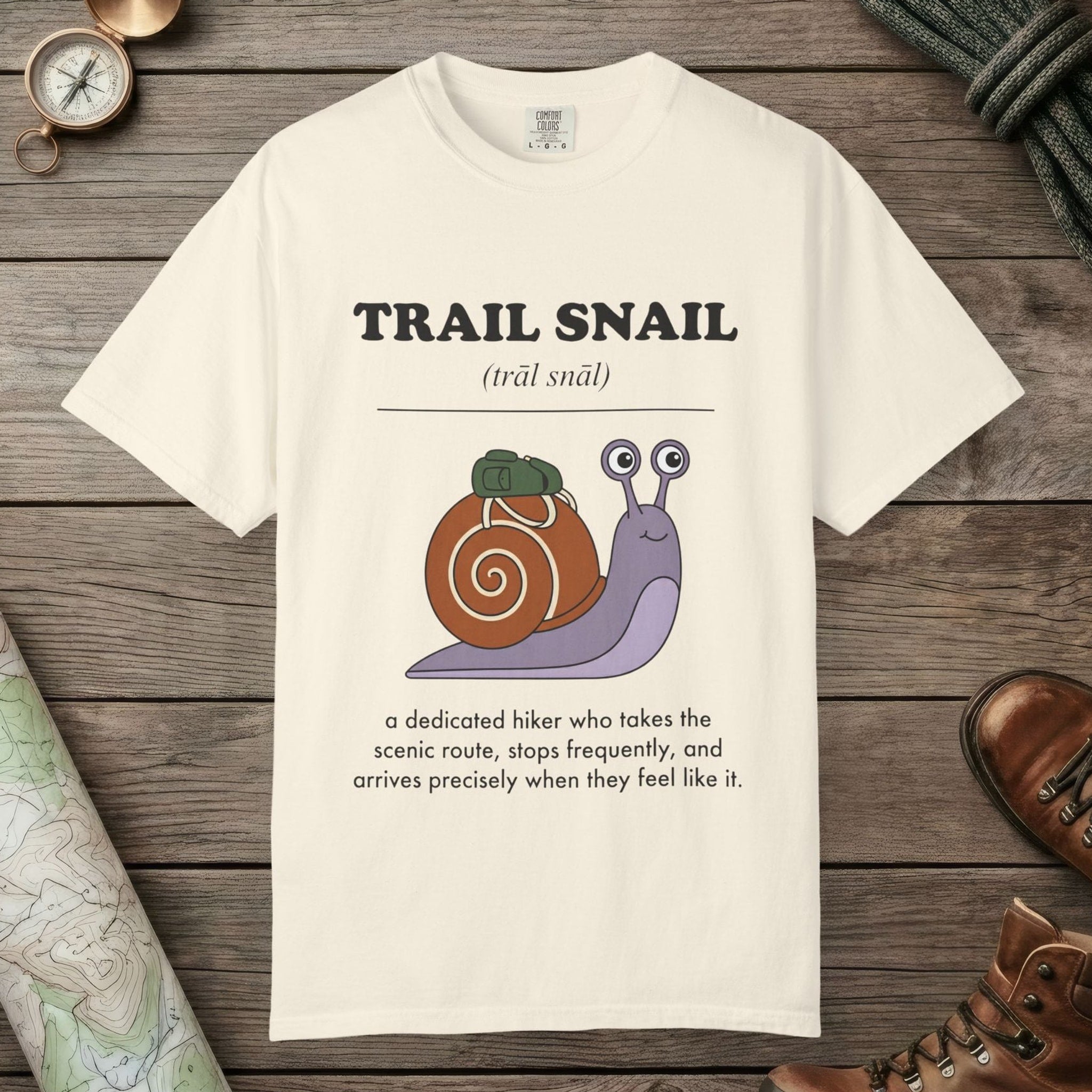 Ivory color unisex graphic t-shirt with "Trail Snail Definition" design