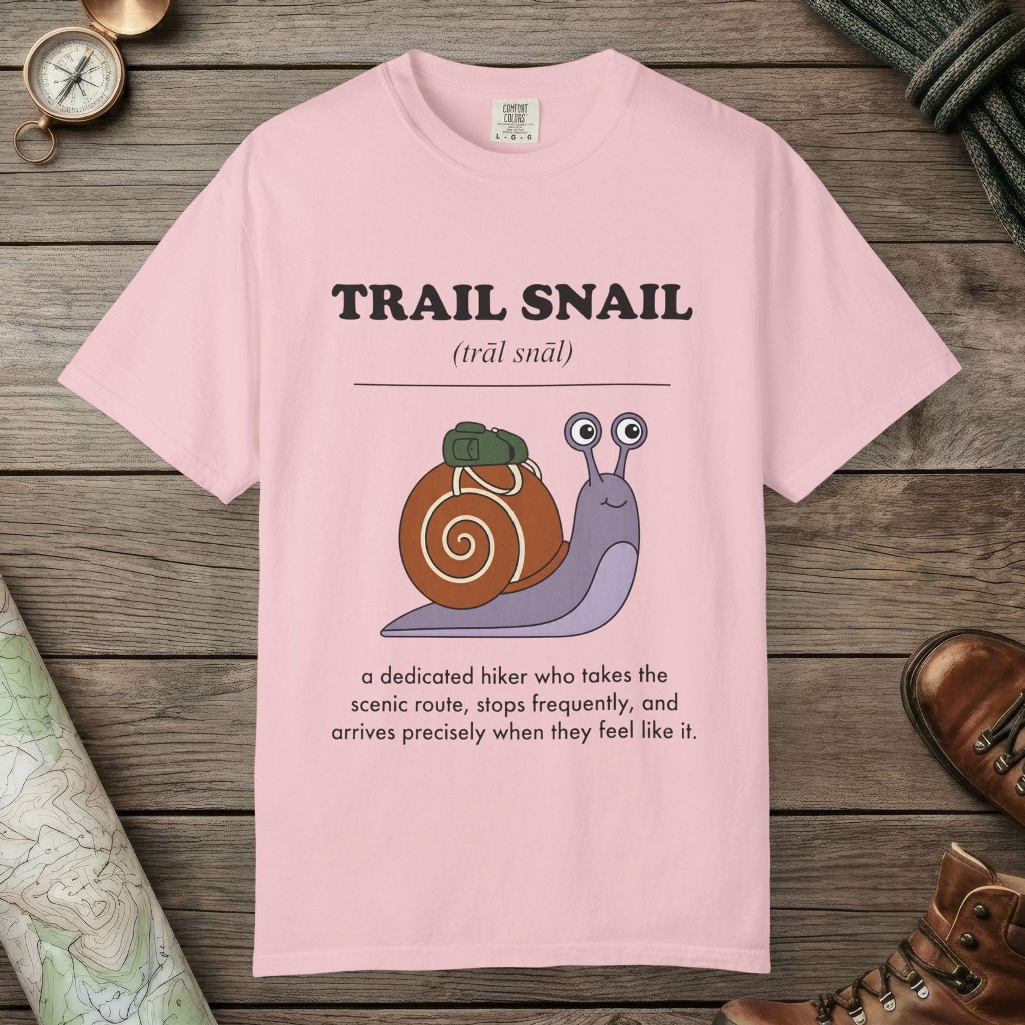 Blossom color unisex graphic t-shirt with "Trail Snail Definition" design