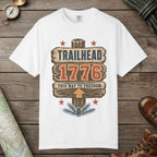 White color unisex graphic t-shirt with "Trailhead 1776" design