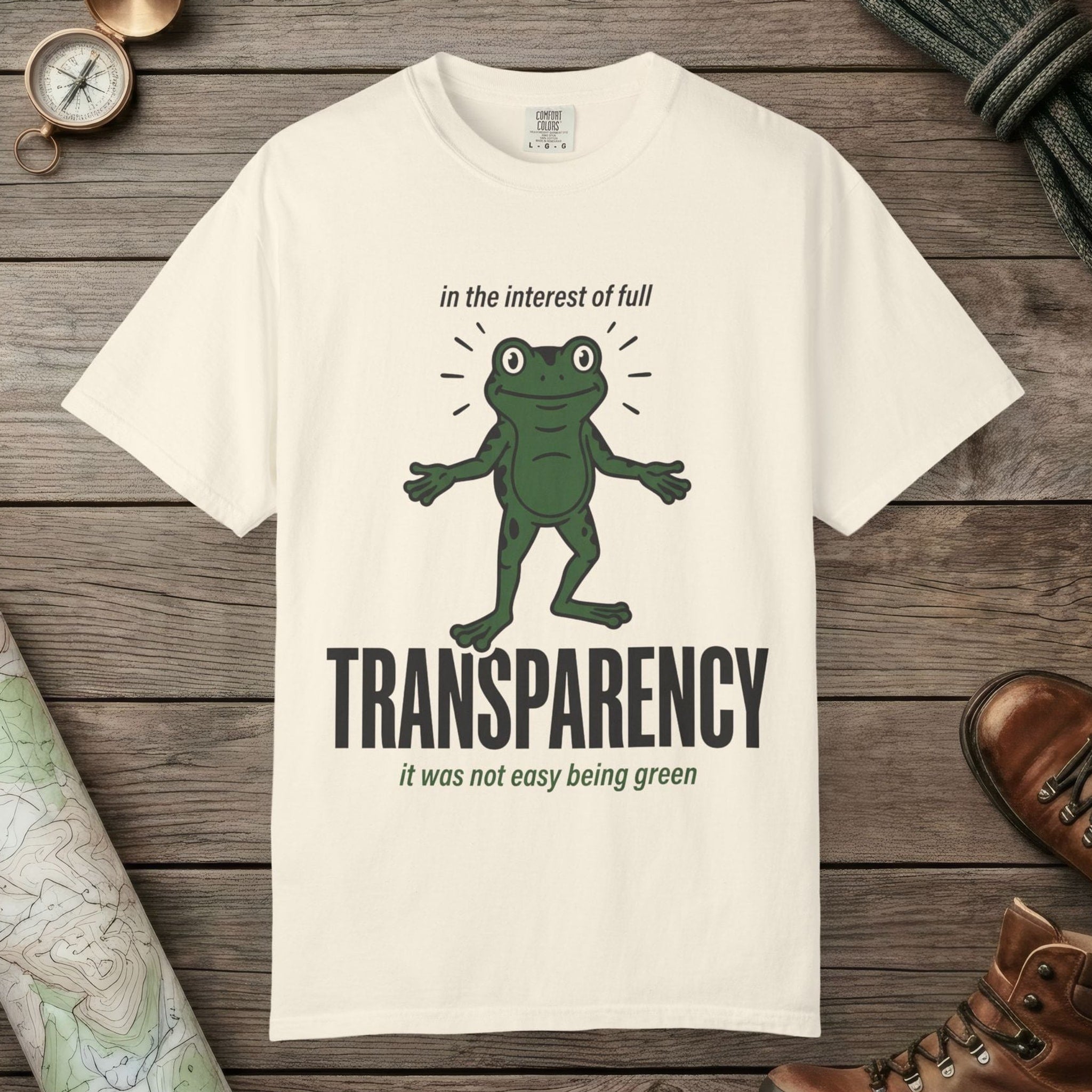 Ivory color unisex graphic t-shirt with "Transparent About It Frog" design