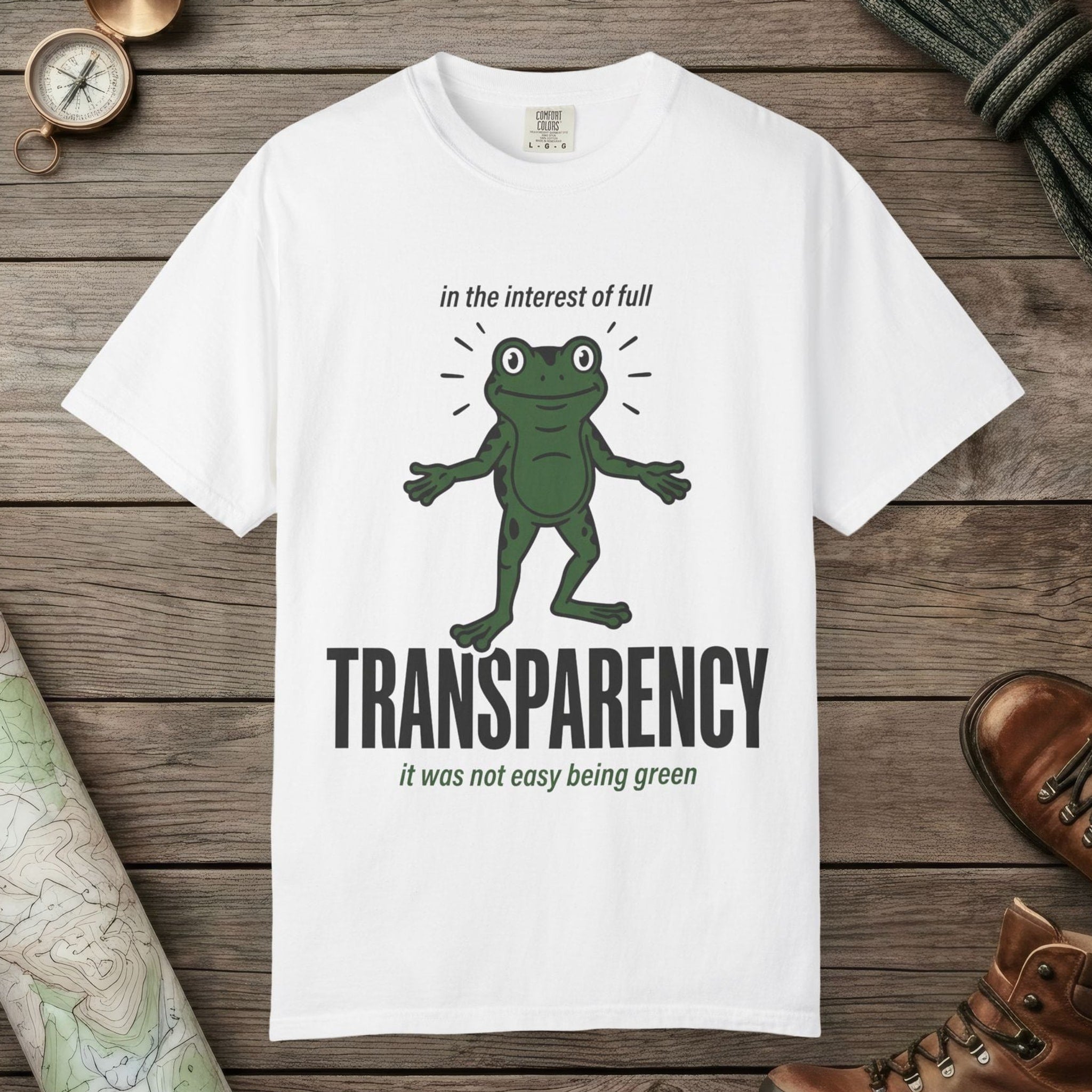 White color unisex graphic t-shirt with "Transparent About It Frog" design