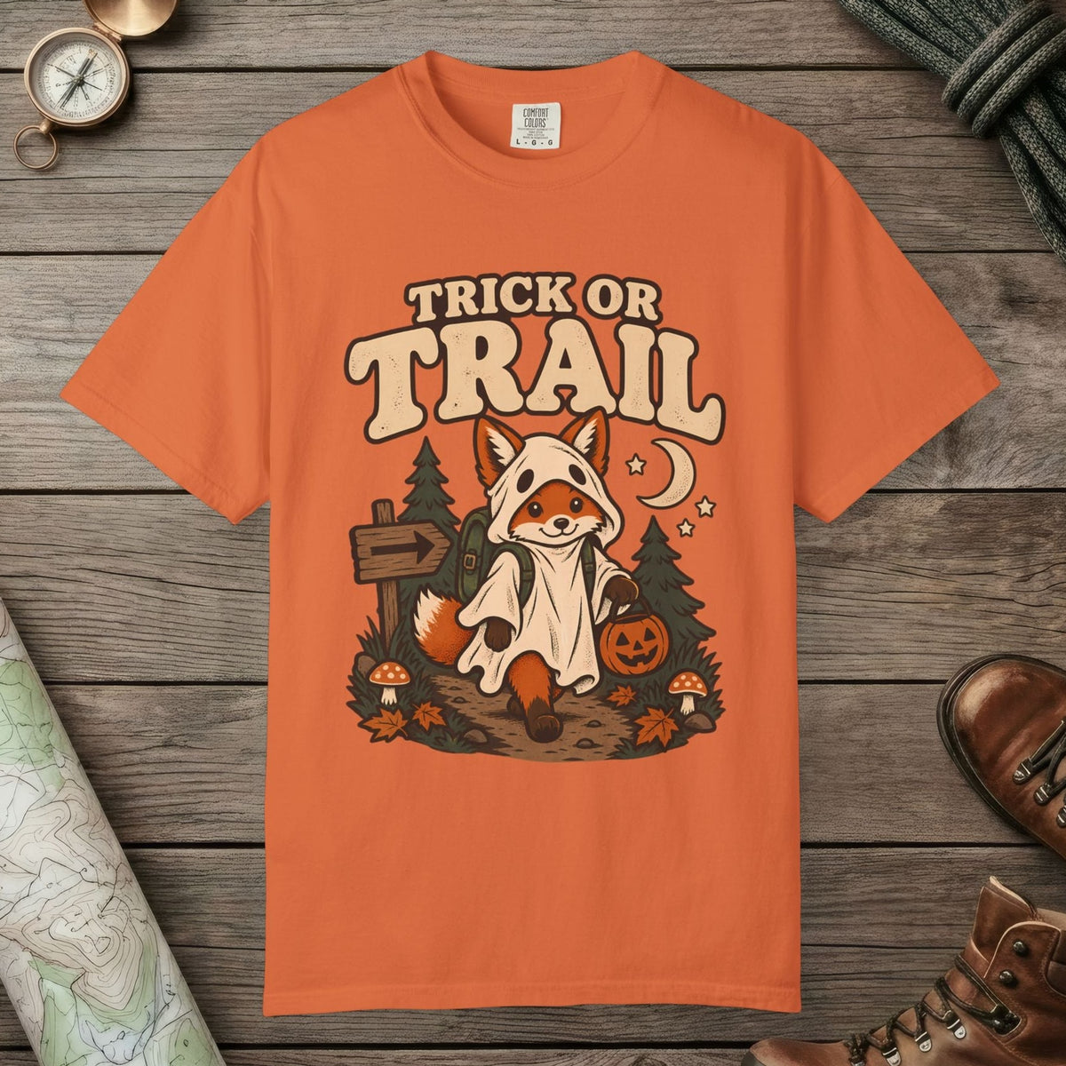 Burnt Orange color unisex graphic t-shirt with "Trick Or Trail" design