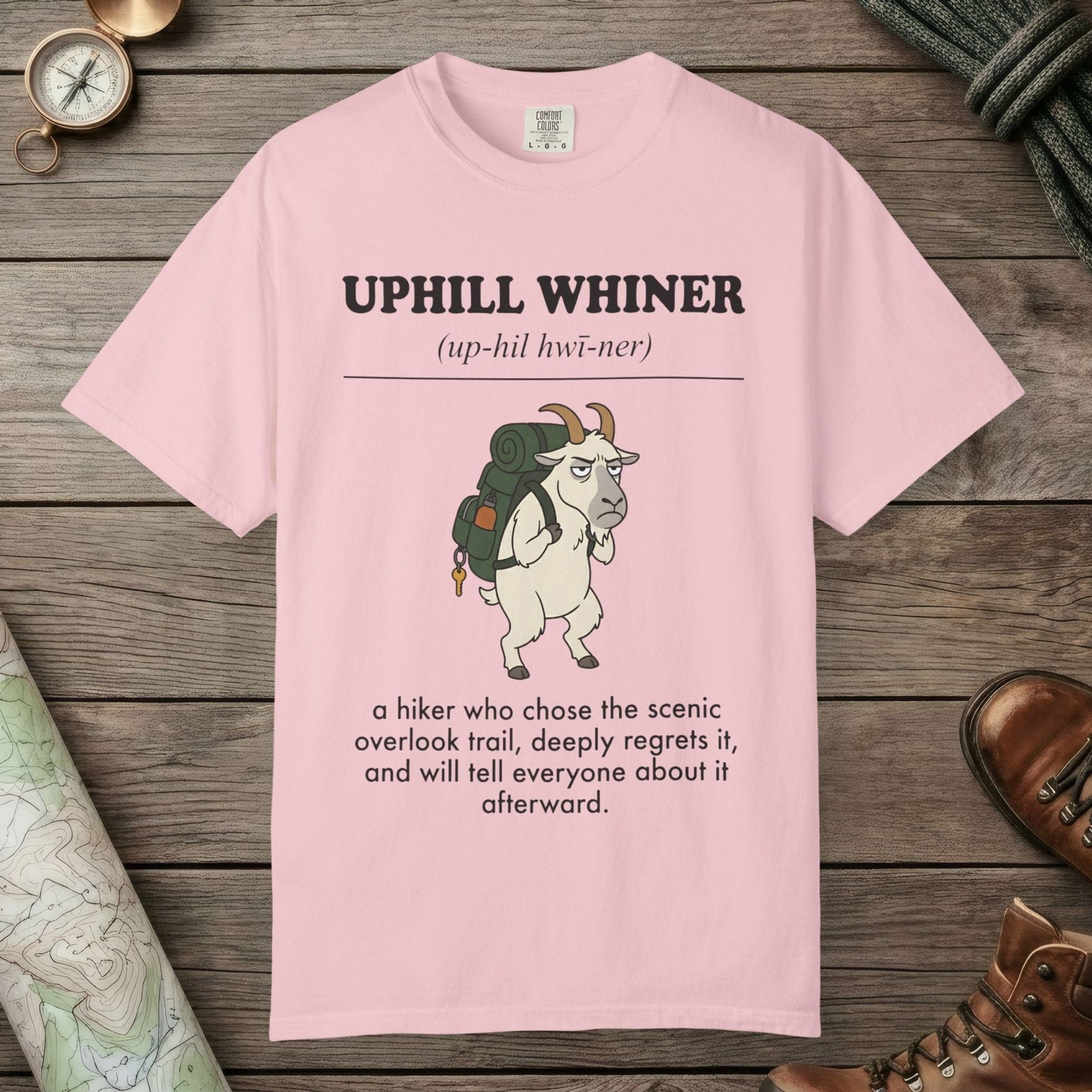 Blossom color unisex graphic t-shirt with "Uphill Whiner Definition" design