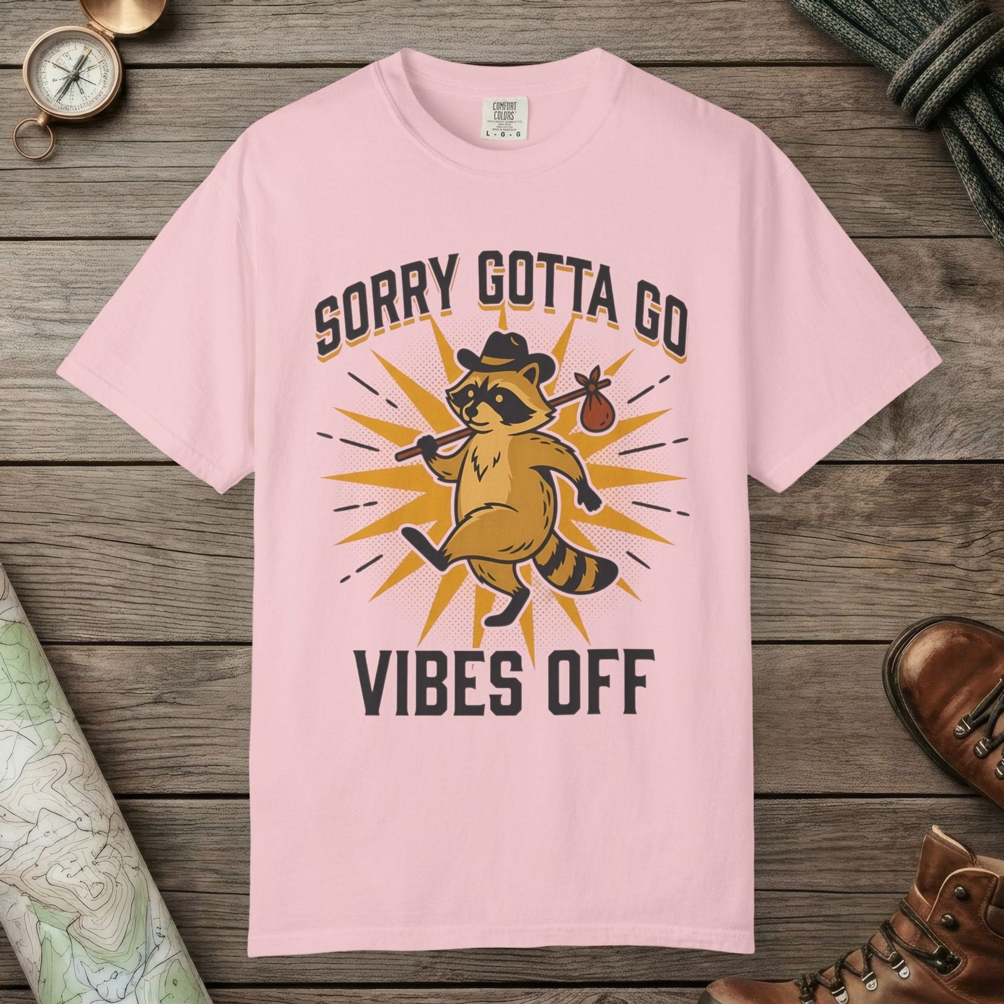 Blossom color unisex graphic t-shirt with "Vibes Off Raccoon" design