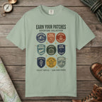 Bay color unisex graphic t-shirt with "Vintage Trail Patches" design