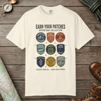 Ivory color unisex graphic t-shirt with "Vintage Trail Patches" design