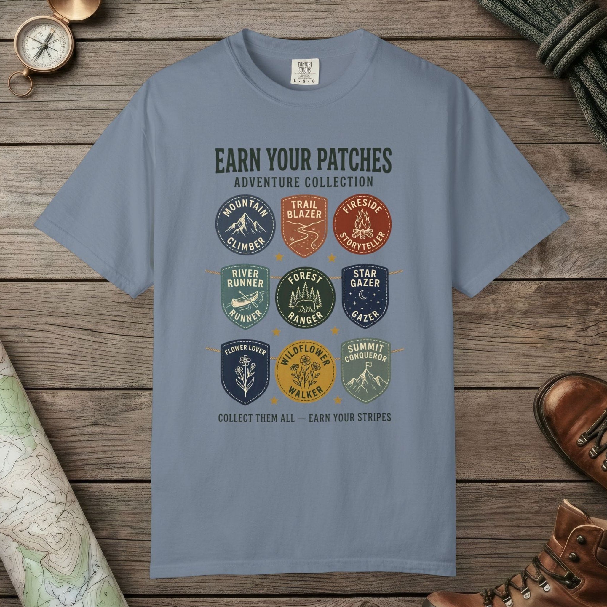Blue Jean color unisex graphic t-shirt with "Vintage Trail Patches" design