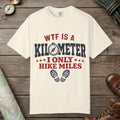 Ivory color unisex graphic t-shirt with "WTF Is a Kilometer" design