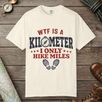 Ivory color unisex graphic t-shirt with "WTF Is a Kilometer" design